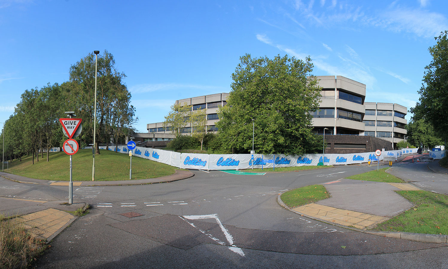 Existing site image showing office building from site entrance.